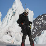 Bjorn prepares the rope for the climb on the glacier