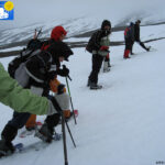 Break during the snow walking with the snow shoes