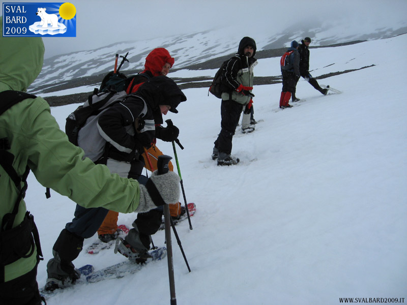 Break during the snow walking with the snow shoes
